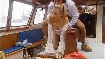 Sexy blonde screwed on board of a row-boat